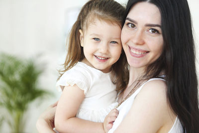 Portrait of happy mother and daughter