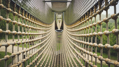 Close-up of rope fence on footbridge