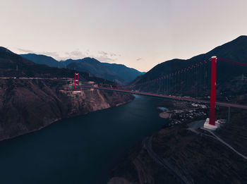 Bridge over river against sky