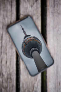 Reflection on smartphone of tv tower in berlin