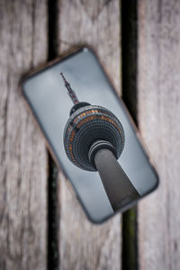 Close-up of smart phone against wall