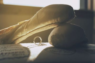 Close-up of rings and shoes on table