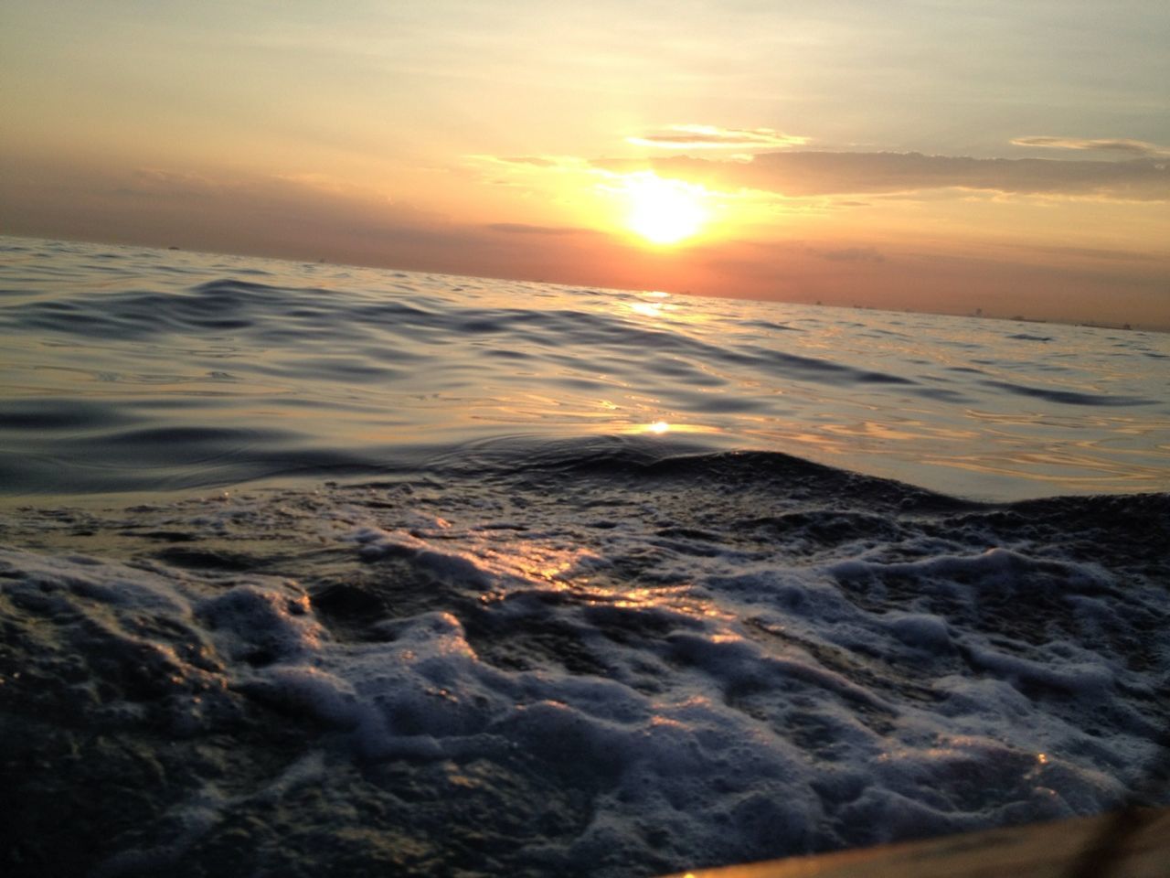 sunset, sea, water, scenics, beauty in nature, tranquil scene, horizon over water, tranquility, wave, sky, nature, sun, beach, idyllic, orange color, shore, seascape, surf, sunlight, cloud - sky