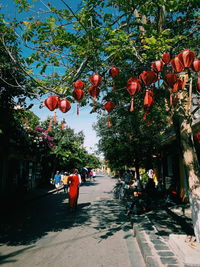 Group of people on tree by building