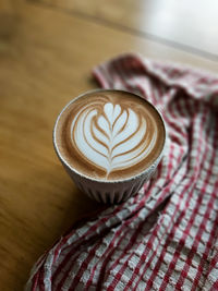 Close-up of cappuccino on table