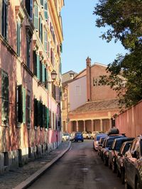 Street amidst buildings in city against sky