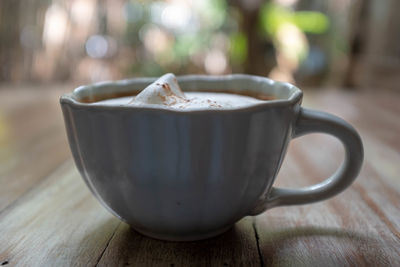 Close-up of coffee cup on table