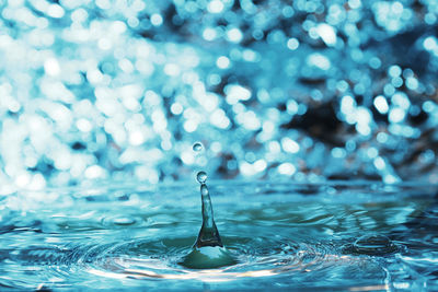 Close-up of drop splashing in water