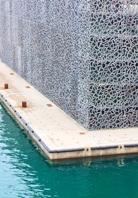 High angle view of swimming pool by sea