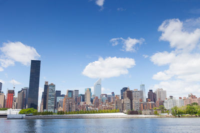 City skyline against cloudy sky