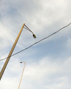 Low angle view of cables against sky