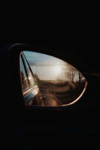 Reflection of car on side-view mirror