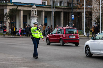 People standing on street in city