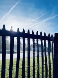 Close-up of fence against sky