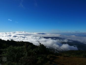 Scenic view of landscape against blue sky