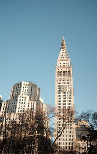 Low angle view of buildings against blue sky