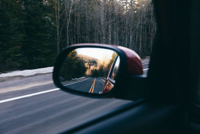 Reflection of car on side-view mirror