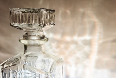 Close-up of glass bottle on table