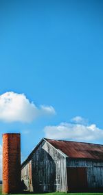 Low angle view of old building against blue sky