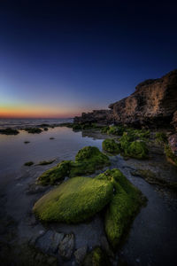 Scenic view of sea against clear sky during sunset