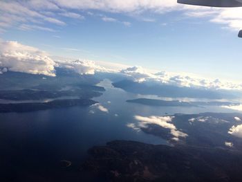 Scenic view of lake against cloudy sky