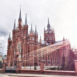 Low angle view of historic cathedral against sky