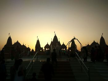 Silhouette of temple against sky at sunset