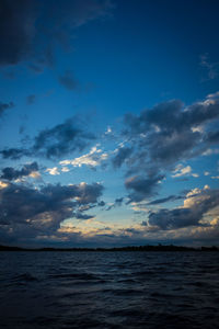 Scenic view of sea against sky at sunset