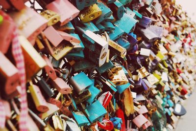 Close-up of padlocks hanging on railing