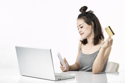Young woman using mobile phone