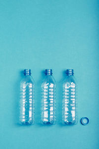 Directly above shot of glass bottle on blue background