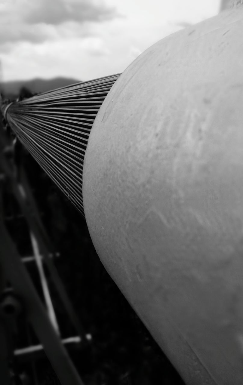 close-up, no people, sky, day, nature, focus on foreground, metal, outdoors, cloud - sky, selective focus, still life, architecture, land, field, sharp, technology, sunlight, steel, industry, alloy