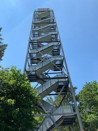 Low angle view of bridge against clear blue sky