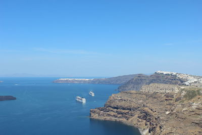 Scenic view of sea against blue sky