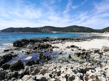 Scenic view of sea against blue sky