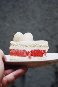 Cropped hand holding ice cream