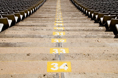 High angle view of empty seats on footpath steps at stadium, barcelona 