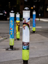 Close-up of multi colored pencils on street