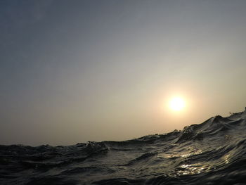 Scenic view of sea against clear sky during sunset