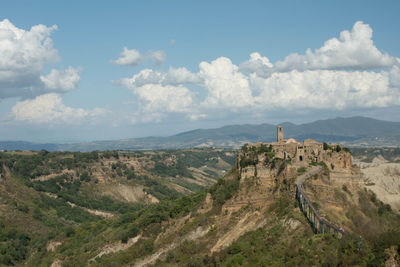 Panoramic view of castle on mountain against sky