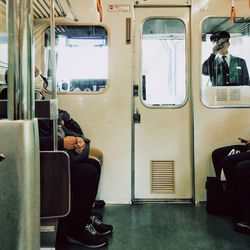 View of people traveling in train