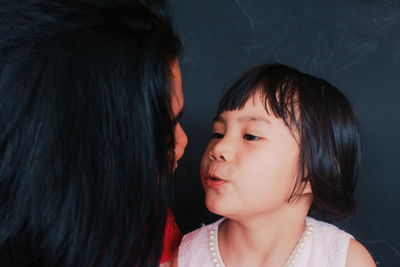 Portrait of mother and daughter