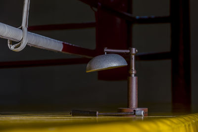 Close-up of electric lamp on table