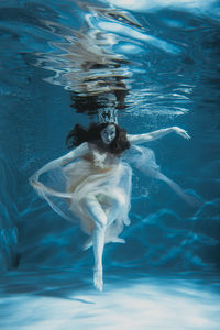 Woman swimming in sea