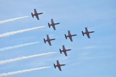 Low angle view of airplane flying in sky