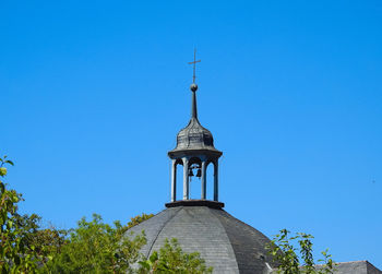 Low angle view of building against clear blue sky