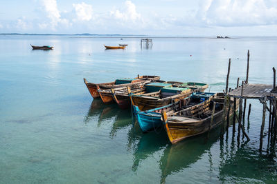 Boats in sea against sky