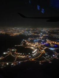 High angle view of illuminated buildings in city at night