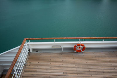 High angle view of red boat on swimming pool against wall