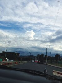 View of road against cloudy sky